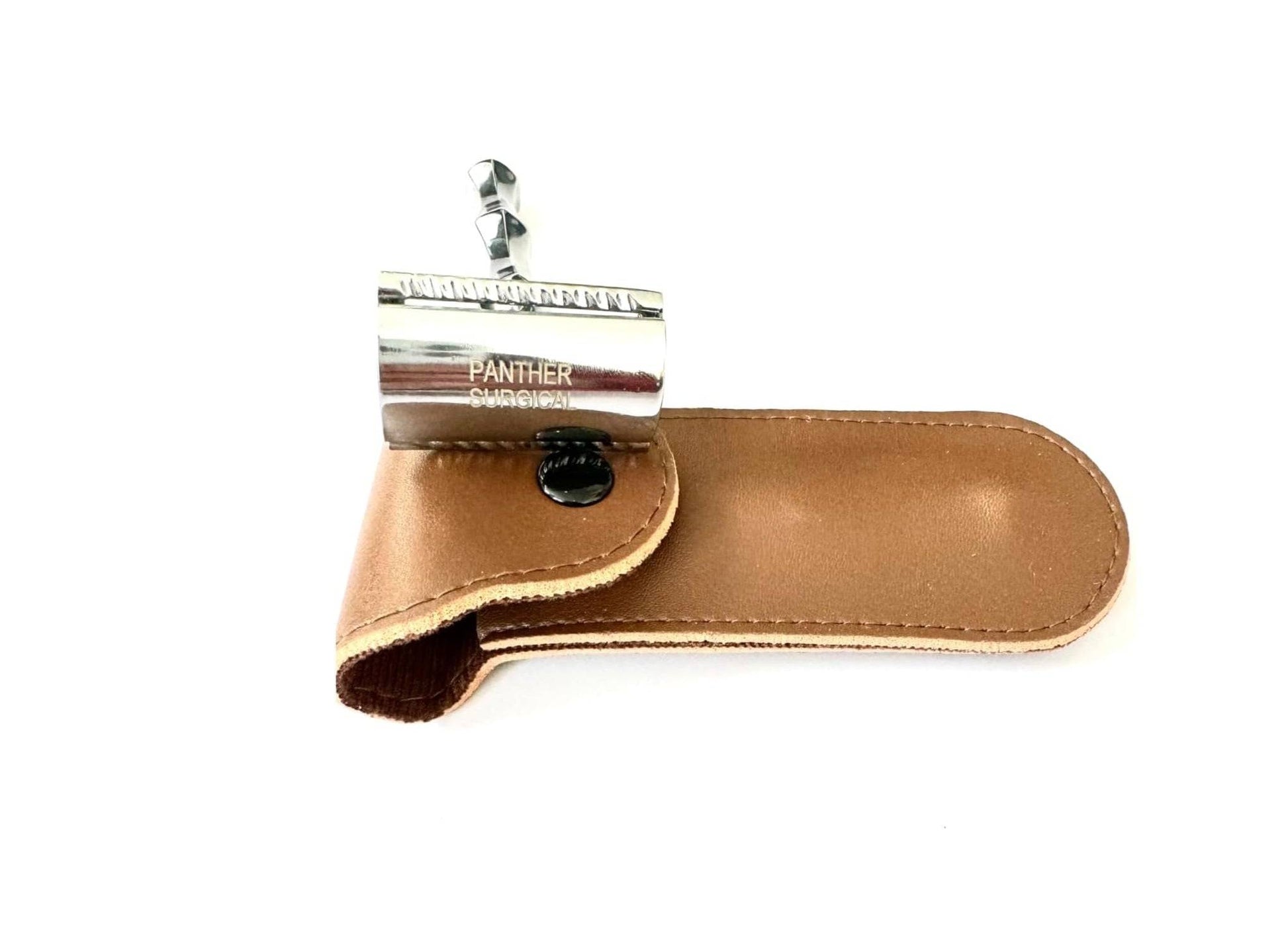 Silver safety razor in brown leather case