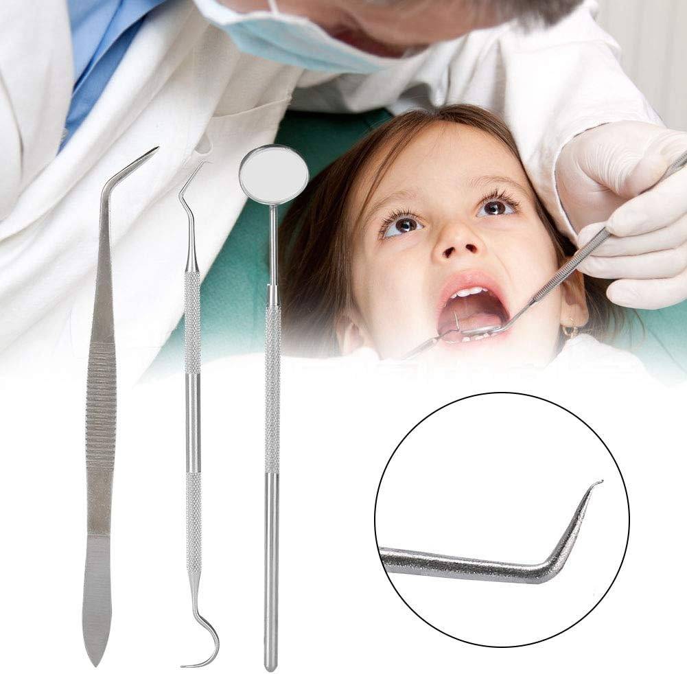 Dentist using stainless steel dental tools on child