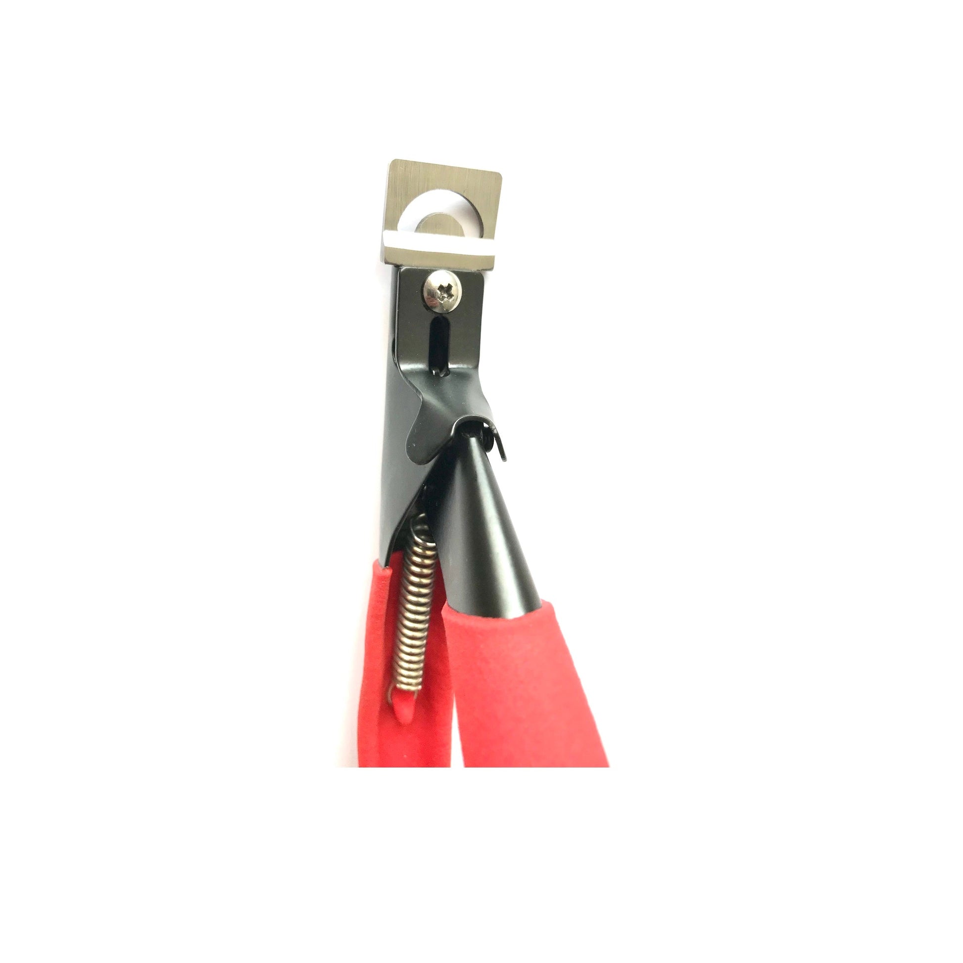 Close-up of red acrylic nail cutter blade