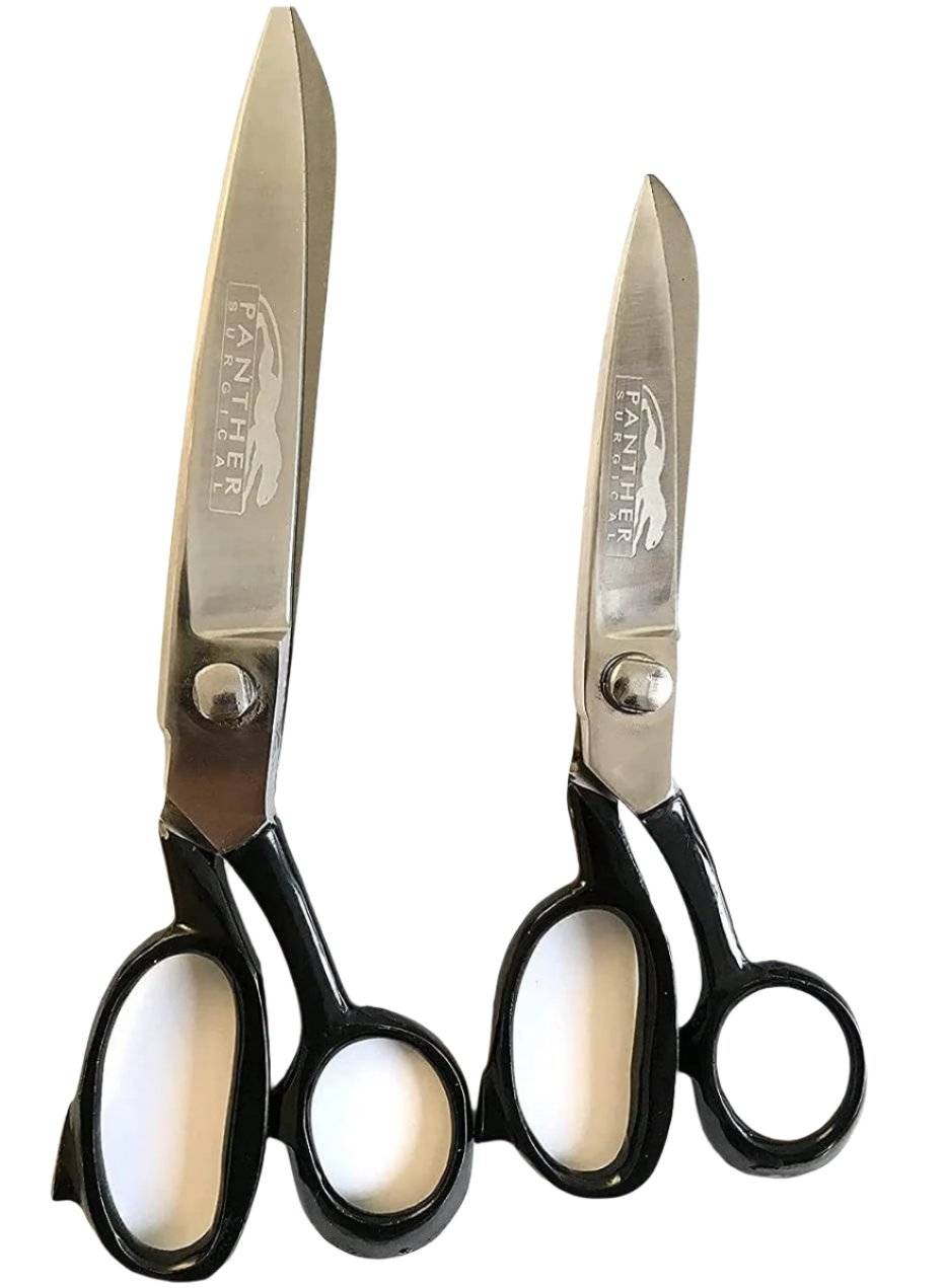 Close-up of two heavy duty tailor scissors with black handles